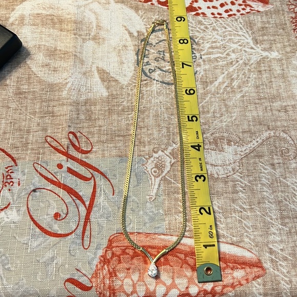 Pear shaped faux diamond necklace with gold chain . New in box. - Picture 2 of 3